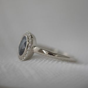 Sapphire halo ring with contoured matching band