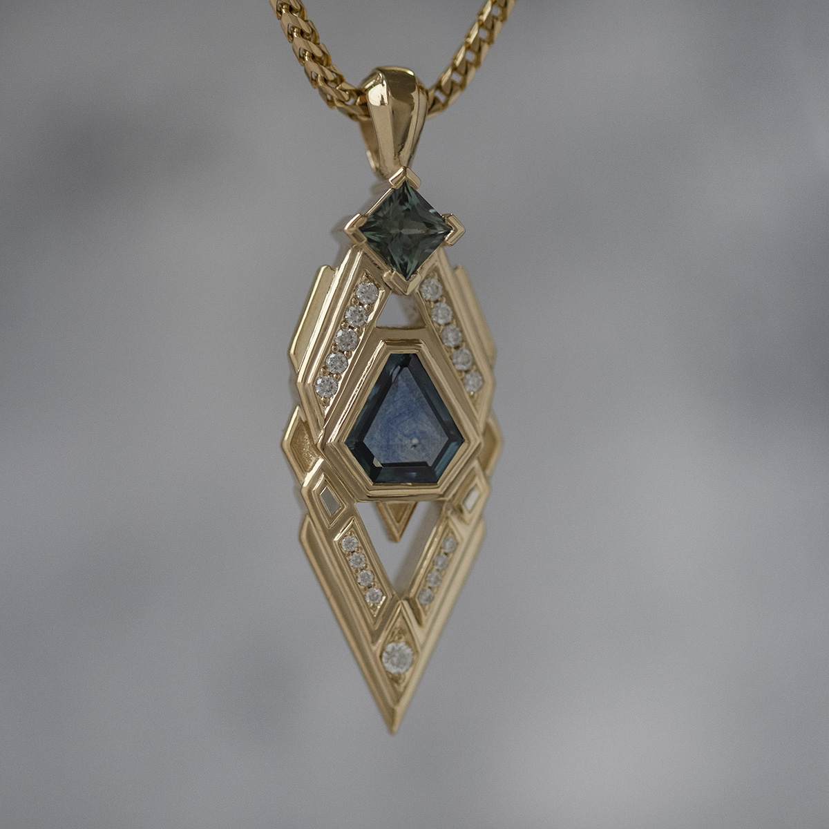 Sapphire and diamond geometric pendant in yellow gold