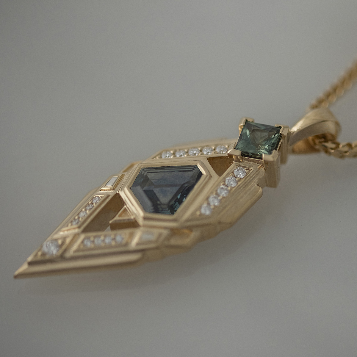 Sapphire and diamond geometric pendant in yellow gold
