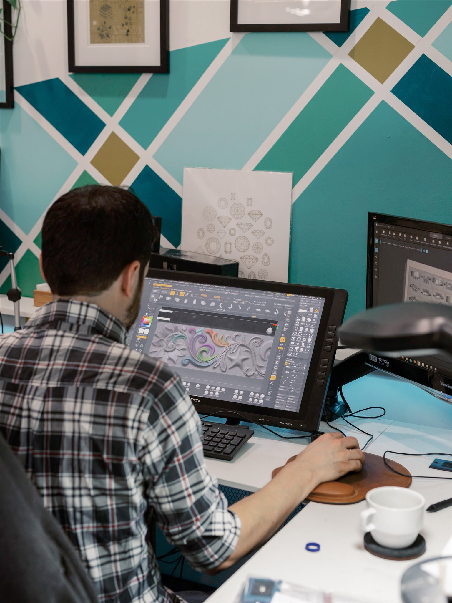 George working on a CAD design